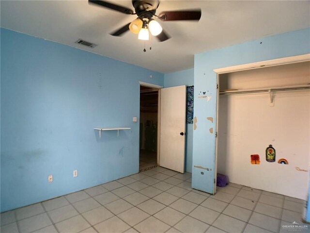 3823 Seles Dr, Weslaco, TX 78599 - unfurnished bedroom featuring light tile patterned floors, a closet, and ceiling fan