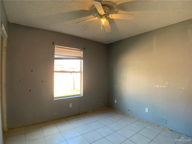 3823 Seles Dr, Weslaco, TX 78599 - empty room featuring a textured ceiling and ceiling fan