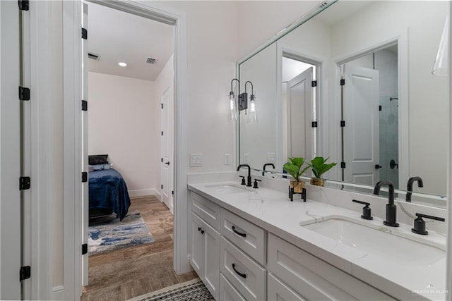 bathroom featuring vanity and hardwood / wood-style floors