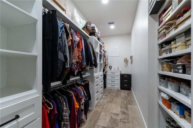 spacious closet featuring light wood-type flooring