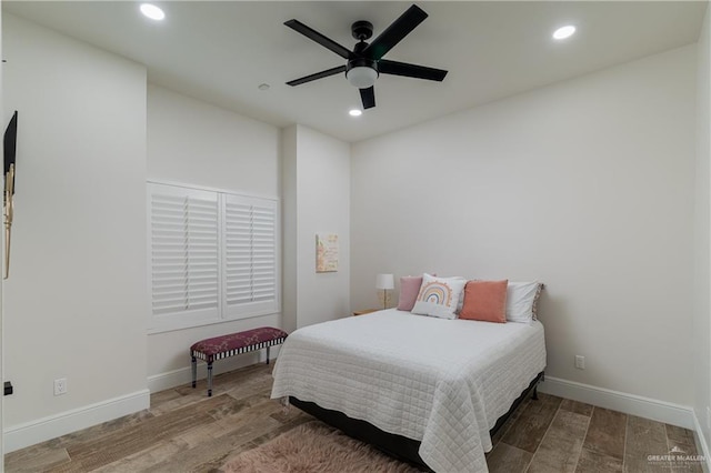 bedroom featuring hardwood / wood-style flooring and ceiling fan