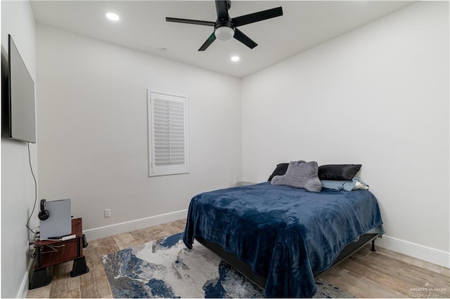 bedroom featuring ceiling fan and light hardwood / wood-style flooring