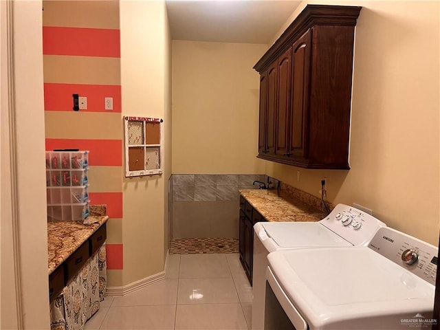 917 Beddoes Rd, La Feria, TX 78559 - laundry area with cabinet space, washer and dryer, and light tile patterned flooring