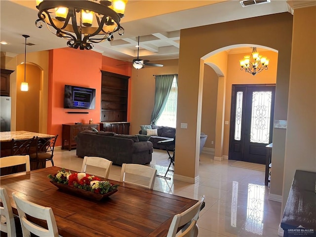 917 Beddoes Rd, La Feria, TX 78559 - dining space featuring arched walkways, a chandelier, coffered ceiling, ceiling fan, and beamed ceiling