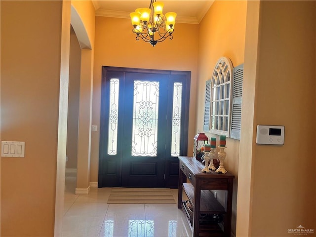 917 Beddoes Rd, La Feria, TX 78559 - entrance foyer with a chandelier, plenty of natural light, tile patterned flooring, crown molding, and arched walkways