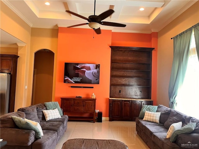 917 Beddoes Rd, La Feria, TX 78559 - living area featuring arched walkways, a ceiling fan, coffered ceiling, light tile patterned flooring, and ornamental molding