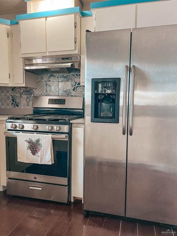 kitchen with white cabinetry, stainless steel appliances, a textured ceiling, decorative backsplash, and exhaust hood