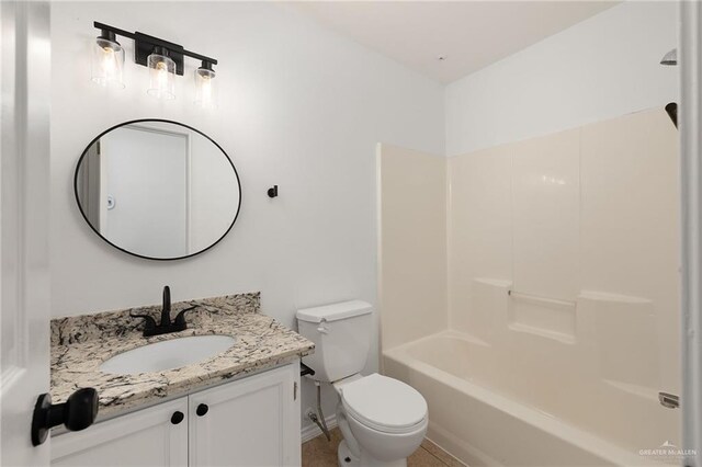 full bathroom featuring bathtub / shower combination, vanity, and toilet