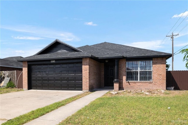 view of front of home featuring a garage and a front yard