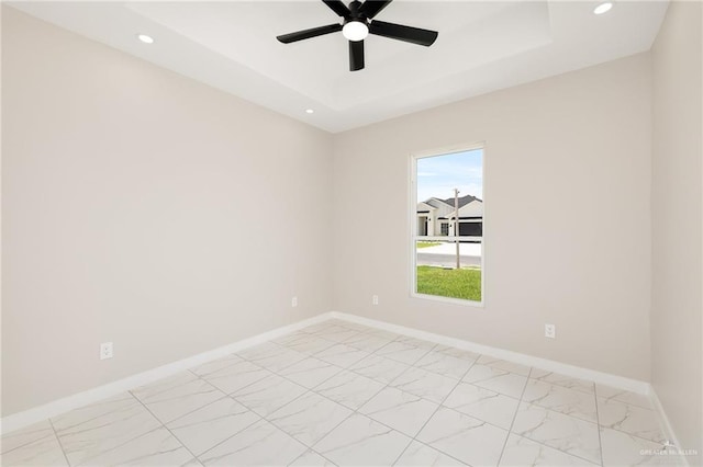 1008 Broken Arrow Dr, Alamo, TX 78516 - unfurnished room with a raised ceiling, ceiling fan, recessed lighting, and light marble finish floors