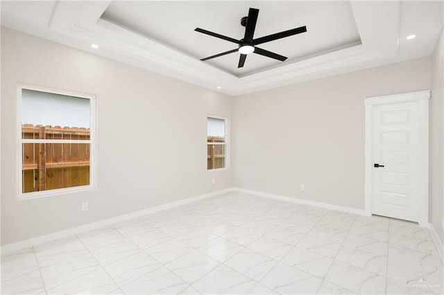 1008 Broken Arrow Dr, Alamo, TX 78516 - spare room with a tray ceiling, ceiling fan, recessed lighting, and light marble finish floors