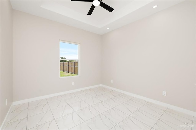 1008 Broken Arrow Dr, Alamo, TX 78516 - spare room with light marble finish floors, a ceiling fan, recessed lighting, and a tray ceiling