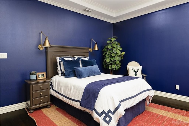 bedroom featuring crown molding and hardwood / wood-style flooring