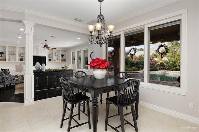 dining room with built in shelves, ornate columns, crown molding, light tile patterned flooring, and ceiling fan with notable chandelier