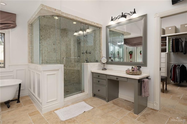 bathroom featuring shower with separate bathtub and vanity