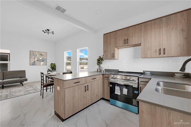 2808 Alpha Rd, Weslaco, TX 78596 - kitchen with stainless steel electric range, a peninsula, a sink, light marble finish flooring, and beamed ceiling