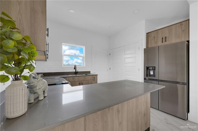 2808 Alpha Rd, Weslaco, TX 78596 - kitchen featuring stainless steel fridge, a sink, a peninsula, modern cabinets, and dark countertops