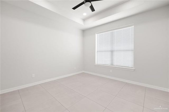 714 W Seminole Ave, Pharr, TX 78577 - unfurnished room featuring a tray ceiling, light tile patterned flooring, and ceiling fan