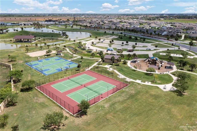 birds eye view of property with a water view