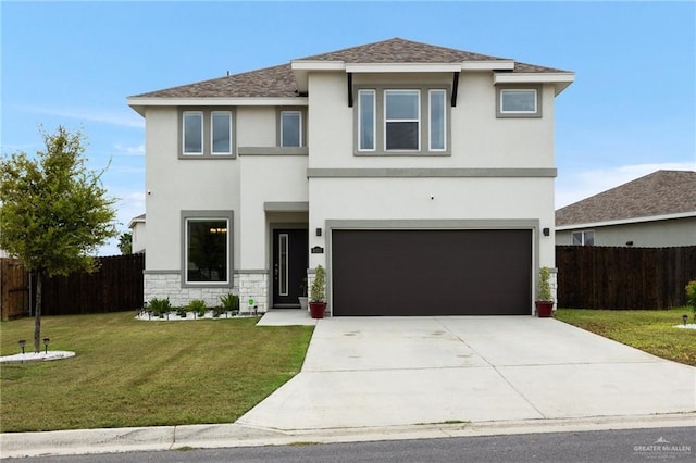 view of front facade with a garage and a front lawn