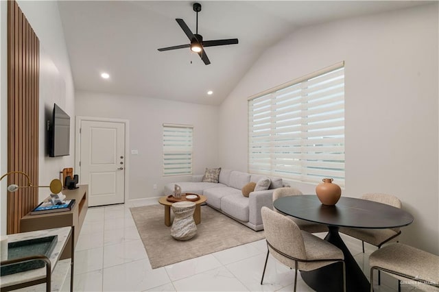 living room with ceiling fan and vaulted ceiling