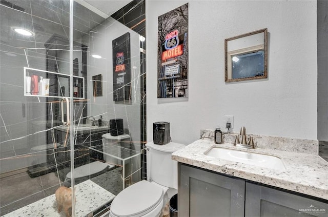 3501 N 39th St, Mcallen, TX 78501 - bathroom featuring toilet, vanity, and a stall shower