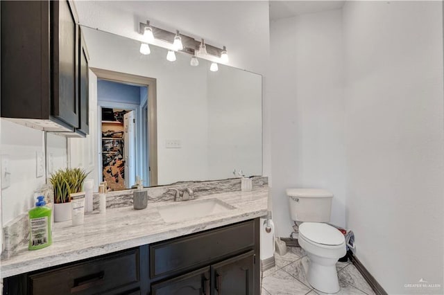 3501 N 39th St, Mcallen, TX 78501 - bathroom featuring toilet, baseboards, and vanity