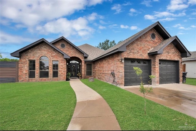 3501 N 39th St, Mcallen, TX 78501 - single story home with roof with shingles, brick siding, concrete driveway, a garage, and a front lawn
