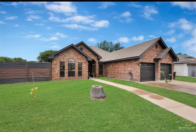 3501 N 39th St, Mcallen, TX 78501 - ranch-style house with a garage, fence, concrete driveway, a front yard, and brick siding