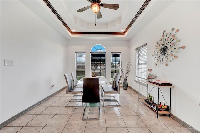 3501 N 39th St, Mcallen, TX 78501 - dining space featuring a ceiling fan, baseboards, a tray ceiling, and light tile patterned flooring