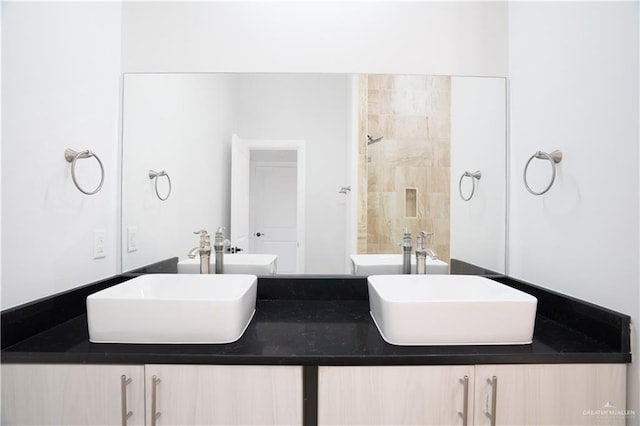 bathroom with double vanity and a sink