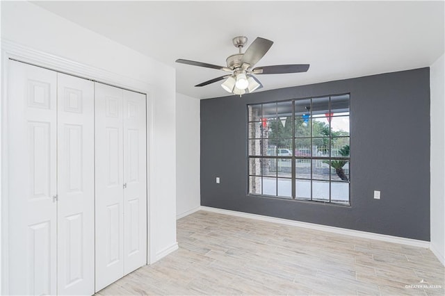 unfurnished bedroom featuring a closet, ceiling fan, and light hardwood / wood-style floors