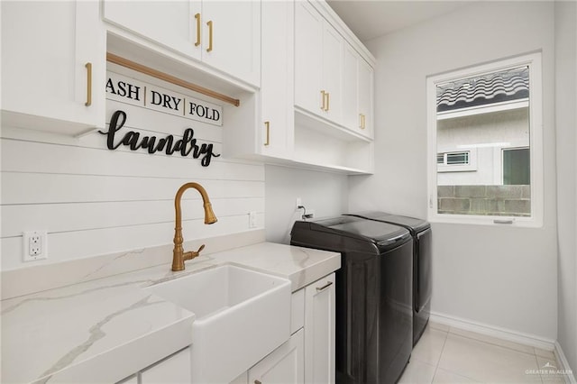 3505 Vendome Dr, Mcallen, TX 78504 - laundry area with separate washer and dryer, cabinet space, baseboards, and light tile patterned floors