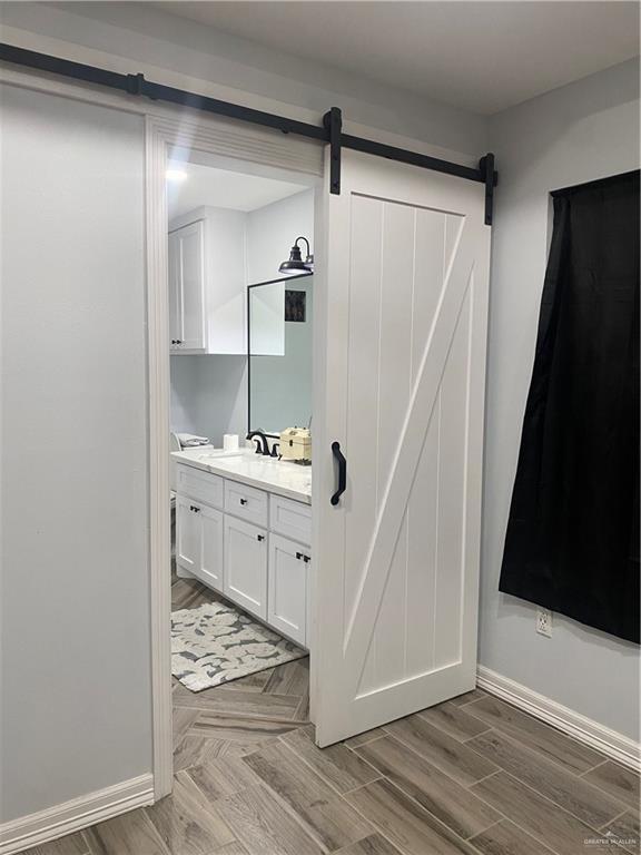 814 N Flag St N, Pharr, TX 78577 - bathroom with vanity and wood finished floors