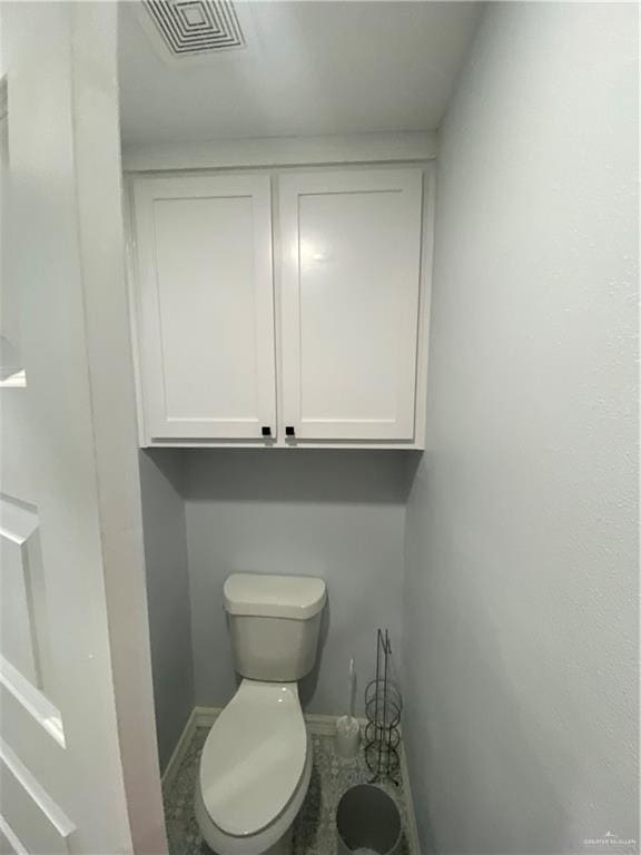814 N Flag St N, Pharr, TX 78577 - bathroom with toilet and baseboards
