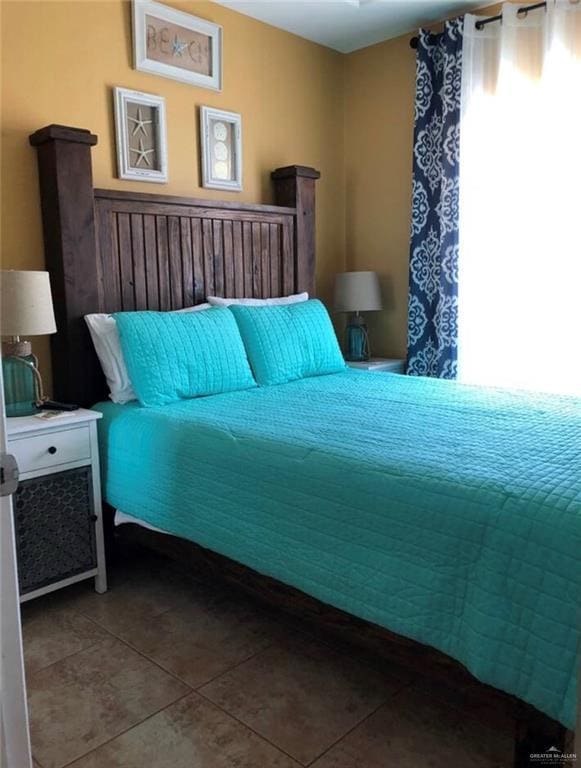 bedroom featuring tile patterned flooring