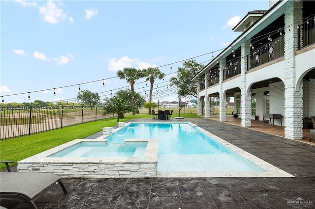 view of swimming pool with a patio area and a yard