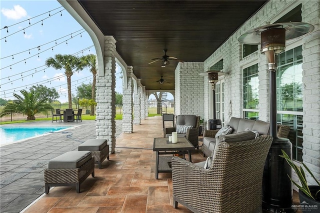 view of patio / terrace with an outdoor living space and ceiling fan