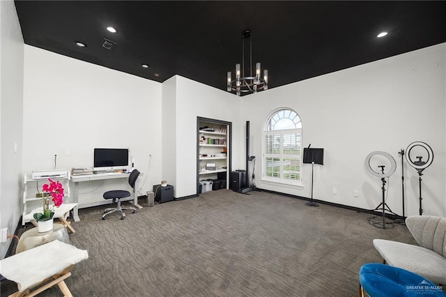 office area with carpet floors and a chandelier