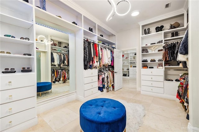 spacious closet featuring light tile patterned floors