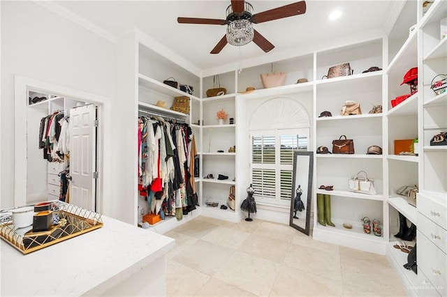 walk in closet featuring ceiling fan