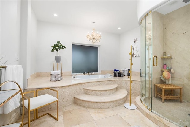 bathroom with tile patterned floors, a notable chandelier, shower with separate bathtub, and sink