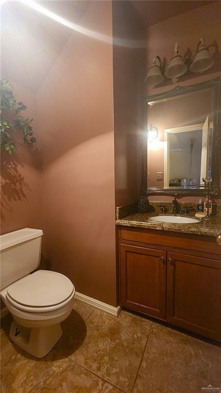 bathroom with vanity and toilet