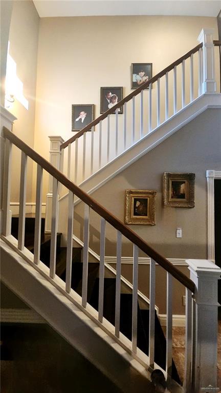 staircase with a towering ceiling