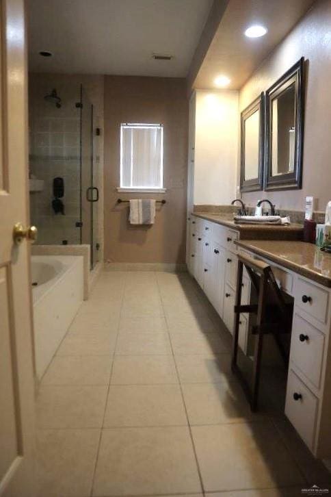 bathroom with vanity, plus walk in shower, and tile patterned flooring