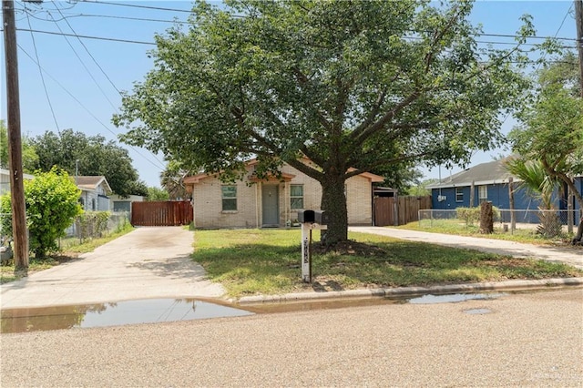 905 N 6th Ave, Edinburg, TX 78541 - view of front of house with driveway and brick siding