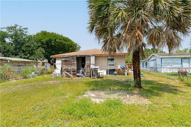 905 N 6th Ave, Edinburg, TX 78541 - back of house featuring brick siding