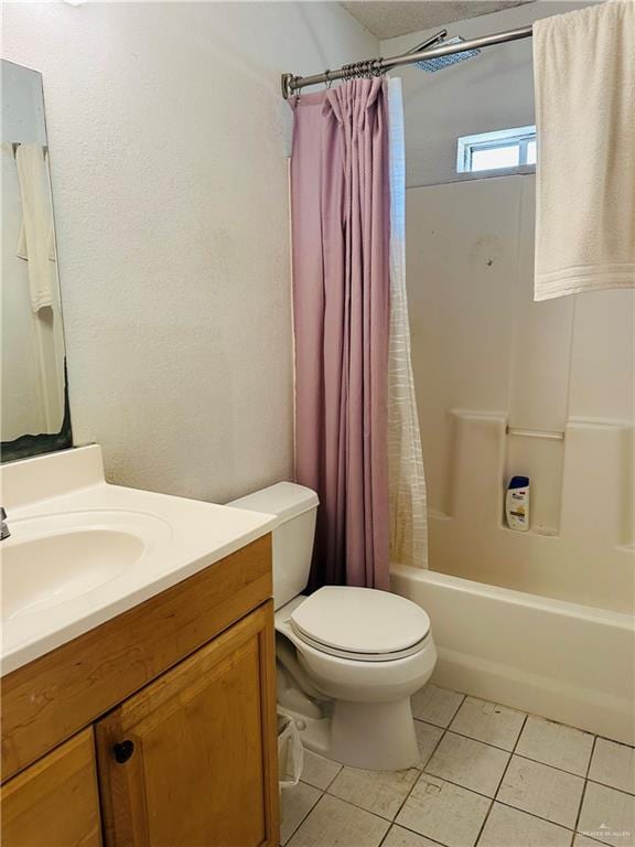 full bathroom featuring tile patterned flooring, vanity, toilet, and shower / bath combo with shower curtain