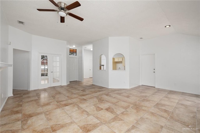 unfurnished room featuring vaulted ceiling, ceiling fan, and french doors