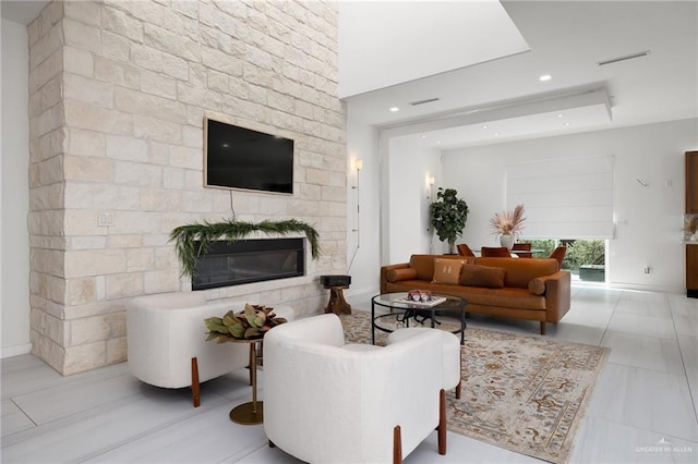 tiled living room with a fireplace